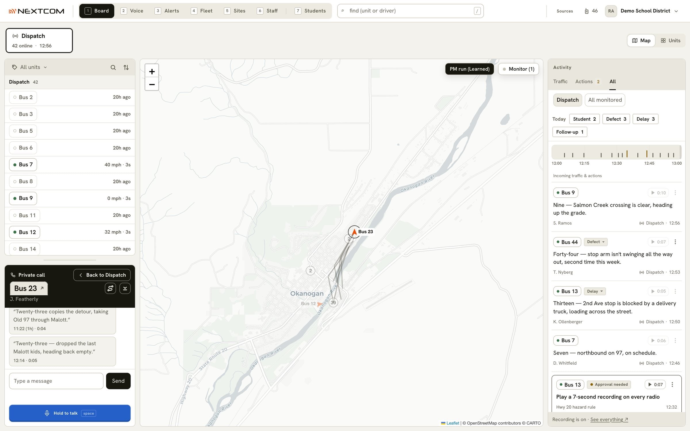 The board: the district's buses on a map, one bus selected with a private call open to it, and the day's radio calls listed beside the map with their categories.